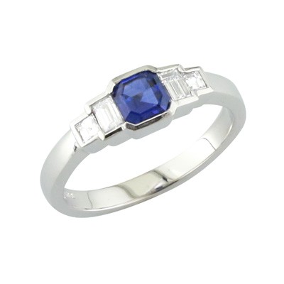 Emerald cut sapphire five stone platinum ring with baguette cut diamonds