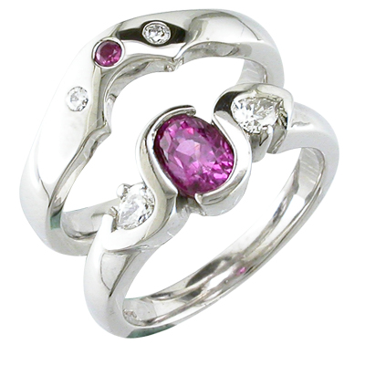 Platinum fitted wedding ring with a pink sapphire and two diamonds